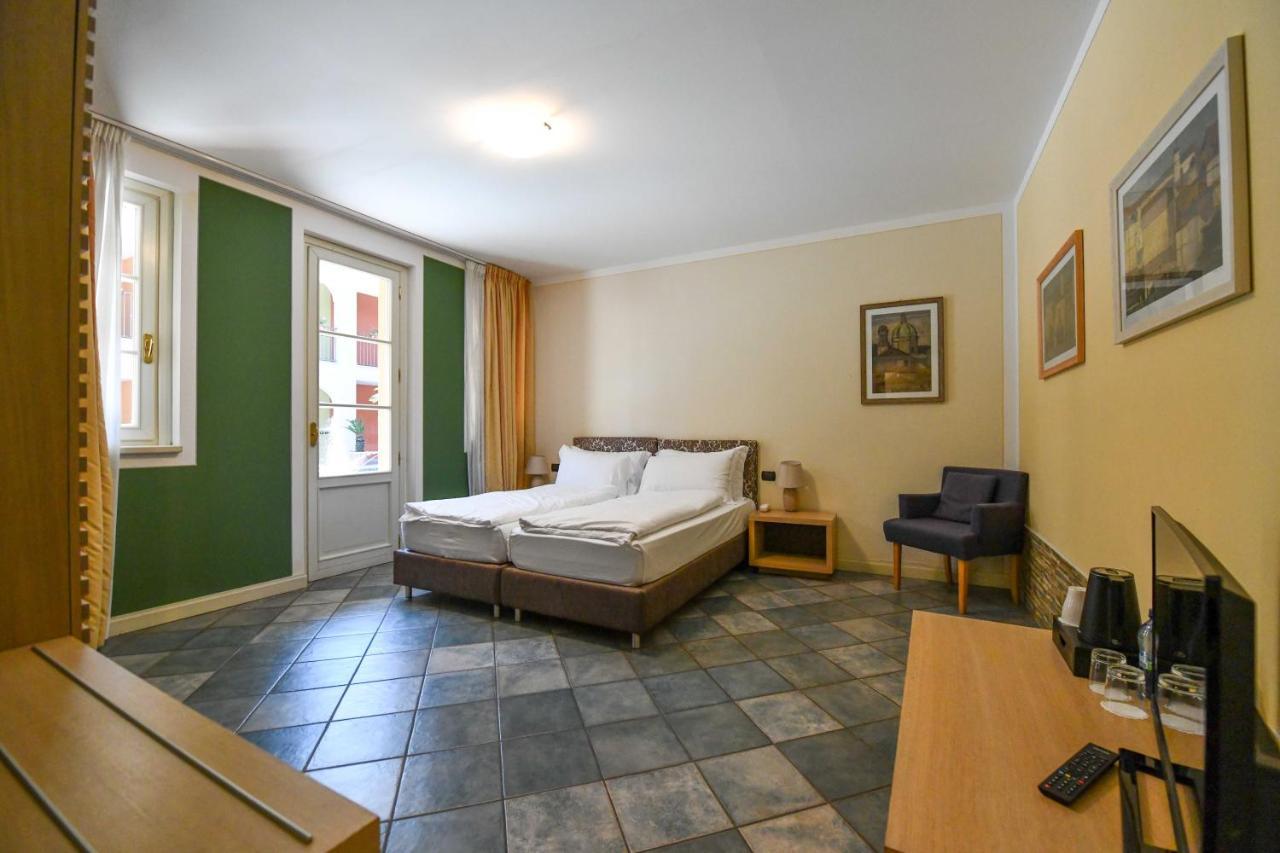 Aquazzurra Resort & Aparthotel Канобио Екстериор снимка
